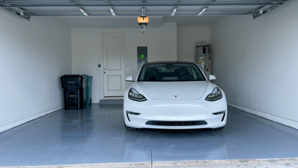 tesla+epoxy+garage Epoxy flooring installation by Ascent Epoxy Miami, highlighting durability and style for garage transformation.